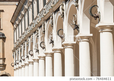 Historical center and colorful painted building (Haus der Kathedrale) with columns and ram heads in downtown of Dresden, Germany, details, closeup Historical center and colorful painted building (Haus der Kathedrale) with columns and ram heads in downtown of Dresden, Germany, details, closeup 76484611