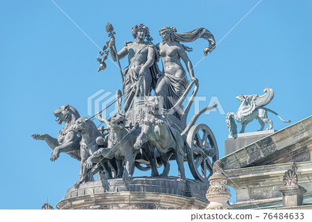 Old statue of Dionis and Aridna quadriga with four panthers on the top of the State Opera House in downtown of Dresden, Germany, details, closeup 76484633