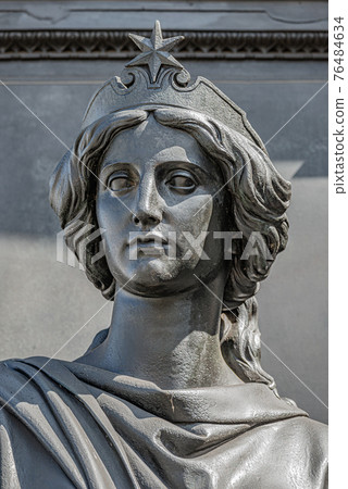 Old statue of a sensual beautiful woman warrior as defender at the Neumarkt in downtown of Dresden, Germany, details, closeup 76484634
