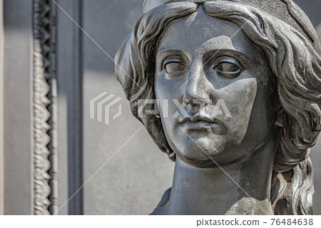 Old statue of a sensual beautiful woman warrior as defender at the Neumarkt in downtown of Dresden, Germany, details, closeup 76484638
