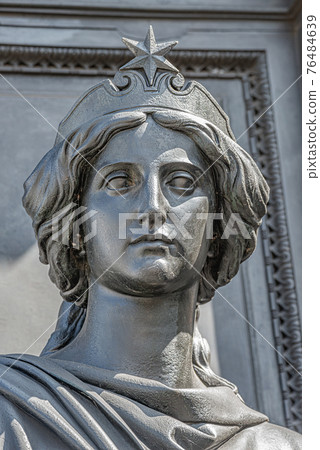 Old statue of a sensual beautiful woman warrior as defender at the Neumarkt in downtown of Dresden, Germany, details, closeup Old statue of a sensual beautiful woman warrior as defender at the Neumarkt in downtown of Dresden, Germany, details, closeup 76484639