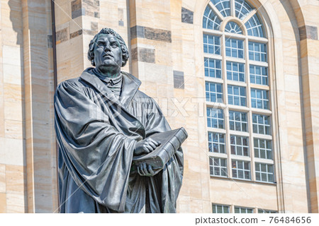 Monument of Martin Luther at  Neumarkt square in downtown of Dresden, a theologist, composer, priest, who has started Reformation in Catholic Church, Germany, details, closeup.. 76484656