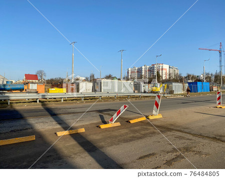 Construction industrial work under the bridge and large highway overpass with the help of modern construction equipment such as asphalt rollers Construction industrial work under the bridge and large highway overpass with the help of modern construction equipment such as asphalt rollers 76484805