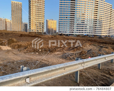 Construction industrial work on the road and a large metal bumper for road safety 76484807