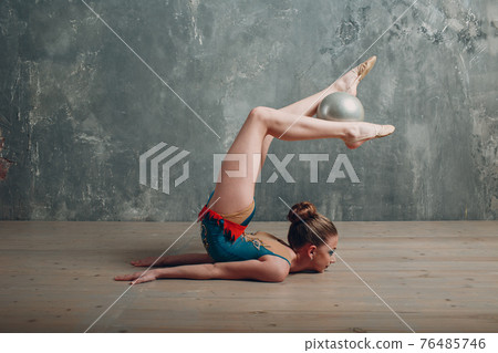 Young girl professional gymnast woman dance rhythmic gymnastics with ball at studio Young girl professional gymnast woman dance rhythmic gymnastics with ball at studio 76485746