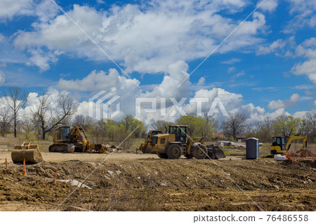 Excavator during construction new road in a plan view of excavator on the street Excavator during construction new road in a plan view of excavator on the street 76486558