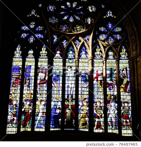 Close-up of the stained glass window above the main west entrance to St. Albans Cathedral in St. Albans, UK. 76487465
