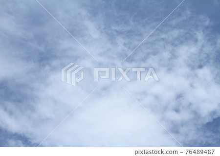 Beautiful blue sky and white clouds of various shapes with sunlight Nature background 76489487