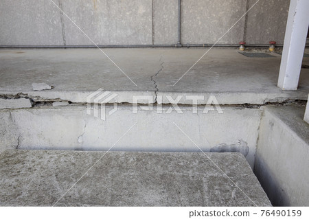 Large cracks in building foundation 76490159