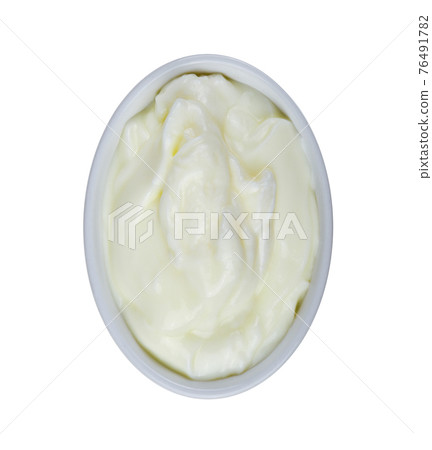 yogurt in white bowl on white background 76491782