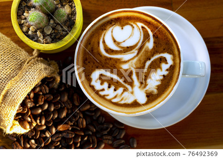 cup of hot coffee on a dark background cup of hot coffee on a dark background 76492369