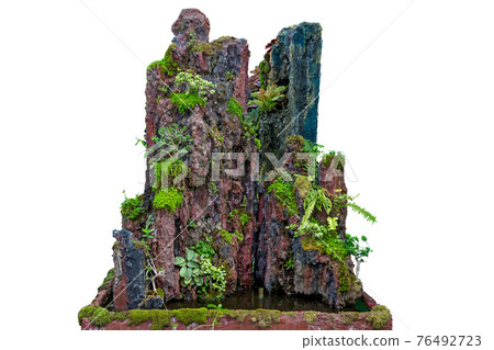 Mini fake waterfall cliffs on white background. Mini fake waterfall cliffs on white background. 76492723