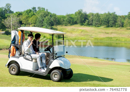 Group Golfer asian man and friend sitting on the car golf go to golf course shot continue game Group Golfer asian man and friend sitting on the car golf go to golf course shot continue game 76492778