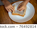 Tear off and leave the ears of bread 76492814