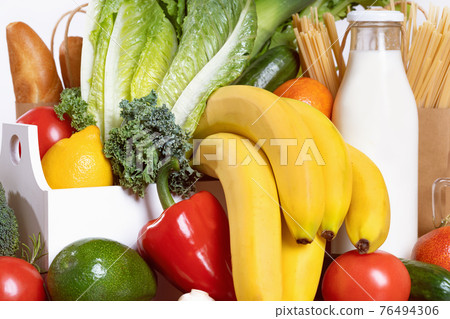 Grocery. box full of fruits and vegetables 76494306