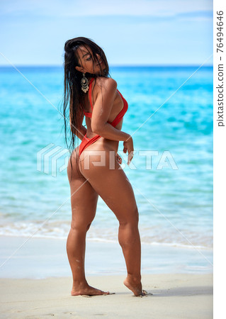 Sexy girl enjoying on the sand at tropical beach 76494646