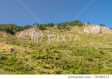 Typical sicilian landscape in the Nebrodi park near the Catafurco waterfalls 76496511