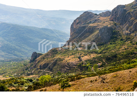 View of Rocca del Crasto near Alcara Li Fusi town in the Nebrodi Park, Sicily View of Rocca del Crasto near Alcara Li Fusi town in the Nebrodi Park, Sicily 76496518