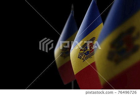 Small national flags of the Moldavia on a black background 76496726