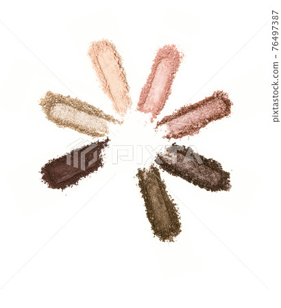 A smashed, neutral toned eyeshadow make up palette isolated on a white background A smashed, neutral toned eyeshadow make up palette isolated on a white background 76497387