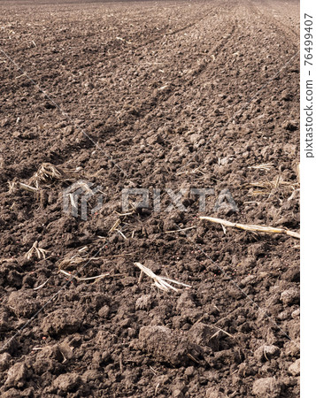 Plowed field at spring Plowed field at spring 76499407