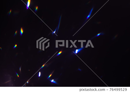 colorful warm rainbow crystal light leaks on black background 76499529