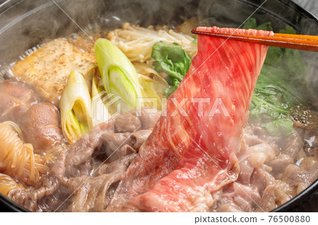 Suki-yaki cooking scene where steam rises 76500880