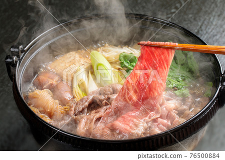 Suki-yaki cooking scene where steam rises 76500884