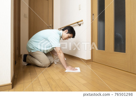 House cleaning man wiping the flooring House cleaning man wiping the flooring 76501298