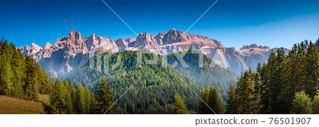 Panoramic view of magical Dolomite peaks of Pizes da Cir, Passo Gardena in sunset colors at blue sky, South Tyrol, Italy, wide angle 76501907