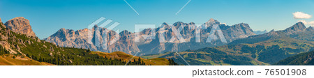 Panoramic view made from Passo Gardena of magical Dolomite peaks of Cima Cunturines in sunset colors at blue sky, South Tyrol, Italy, wide angle Panoramic view made from Passo Gardena of magical Dolomite peaks of Cima Cunturines in sunset colors at blue sky, South Tyrol, Italy, wide angle 76501908