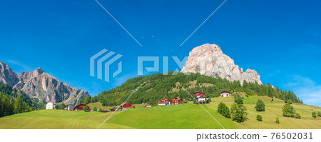 Panoramic view of magical Dolomite peak Sassongher, forests, valleys at sunny day and blue sky, Colfosco, Corvara, South Tyrol, Italy, wide angle Panoramic view of magical Dolomite peak Sassongher, forests, valleys at sunny day and blue sky, Colfosco, Corvara, South Tyrol, Italy, wide angle 76502031