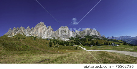 Panoramic view of magical Dolomite peaks of Pizes da Cir, Passo Gardena at blue sky and sunny day, South Tyrol, Italy, wide angle 76502786