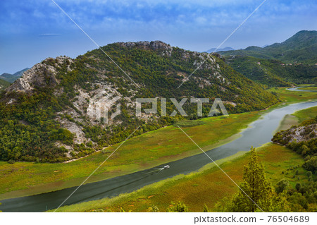Rijeka Crnojevica River near Skadar Lake - Montenegro 76504689
