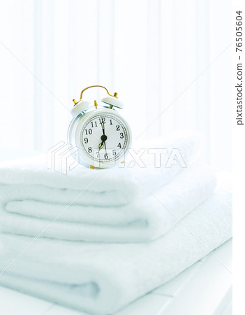 Alarm Clock and Towel 76505604