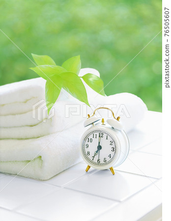 Towel and alarm clock 76505607