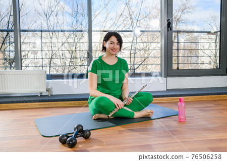 Smiling sport woman hold bassoon music instrument Smiling sport woman hold bassoon music instrument 76506258