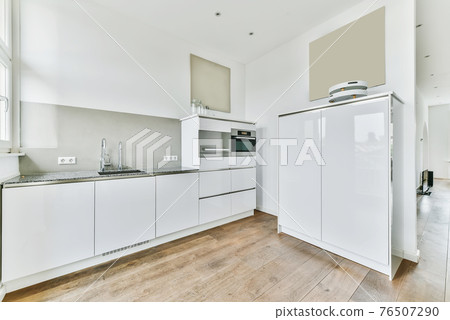 Light kitchen with stylish portraits Light kitchen with stylish portraits 76507290
