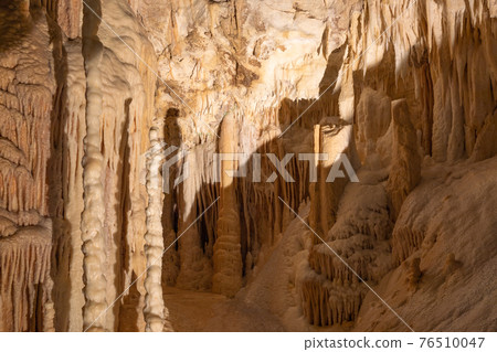 Stalactite and Stalagmite formations into the Frasassi Caves (Grotte di Frasassi) Stalactite and Stalagmite formations into the Frasassi Caves (Grotte di Frasassi) 76510047