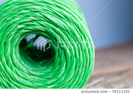 Skein of green polypropylene cord, closeup 76511105