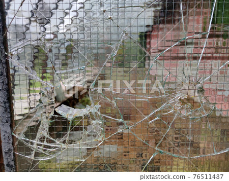 gun bullet broken window glass gun bullet broken window glass 76511487