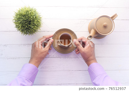 pouring tea from a tea ceremony top down  76512937