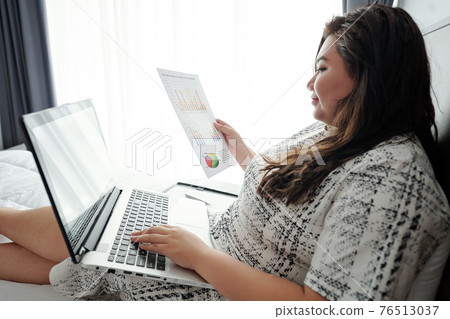 Businesswoman analyzing sales statistics Businesswoman analyzing sales statistics 76513037