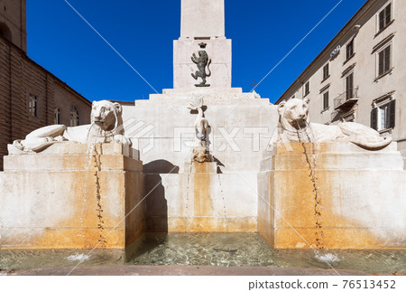 View the famous obelisk fountain on square (Piazza Federico II) in Jesi town. Marche, Italy 76513452