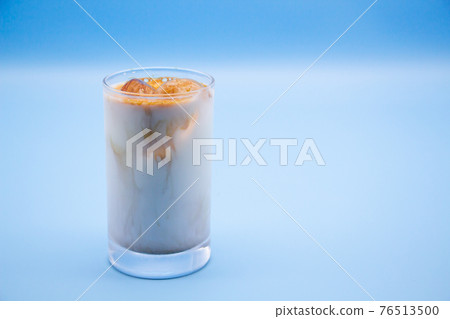 Blue background and ice cafe au lait Blue background and ice cafe au lait 76513500