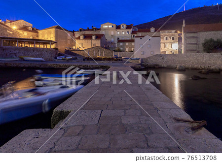 Dubrovnik. Old stone city walls and towers at sunset. Dubrovnik. Old stone city walls and towers at sunset. 76513708