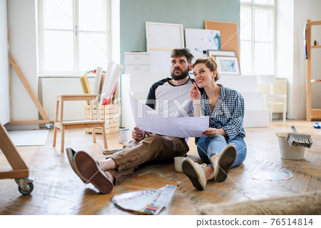 Mid adults couple planning indoors at home, relocation and diy concept. 76514814