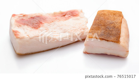 raw lard two pieces on white background, pork fat raw lard two pieces on white background, pork fat 76515017