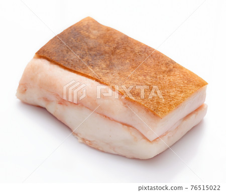 raw lard piece on white background, pork fat 76515022