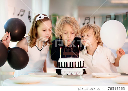 Music and piano birthday party. Kid with cake. Music and piano birthday party. Kid with cake. 76515263